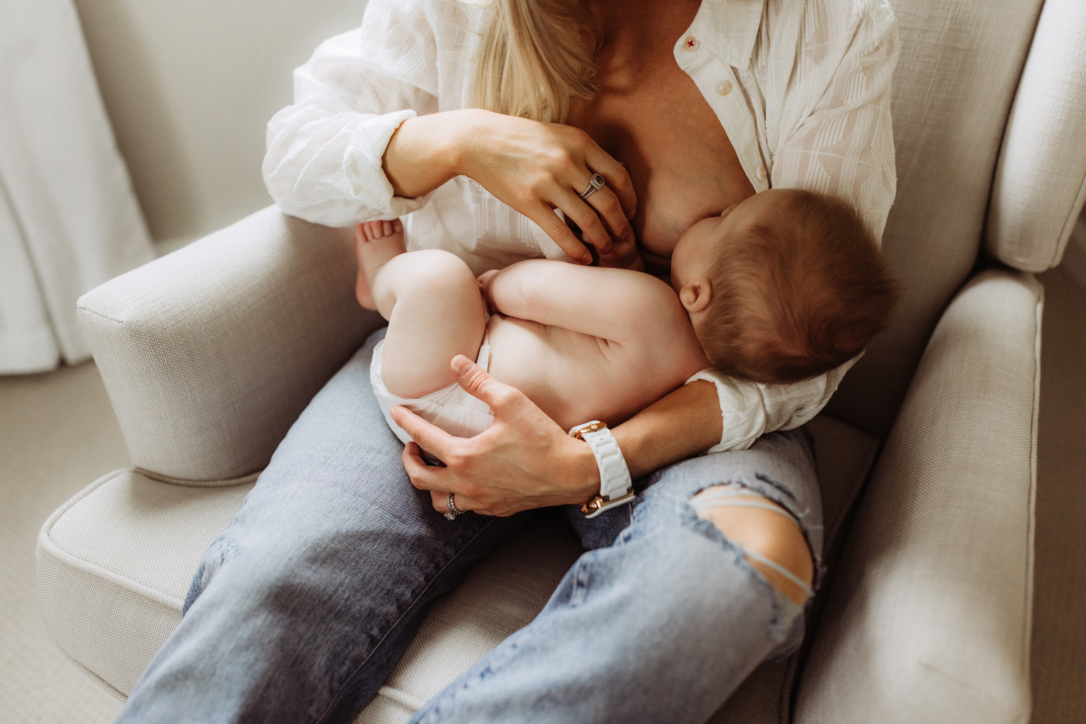 Mother Breastfeeding Son on an Armchair